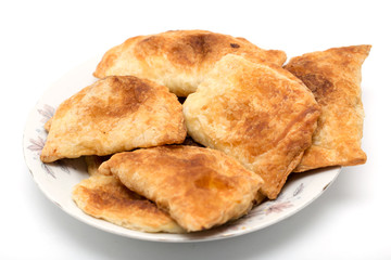 fresh tasty meat pies on a white background