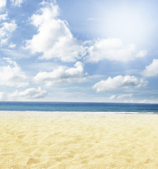 Sand, sea and sun in blue sky. Beach summer background