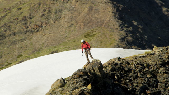 Aerial view of male mountain climber in summer, Alaska, USA