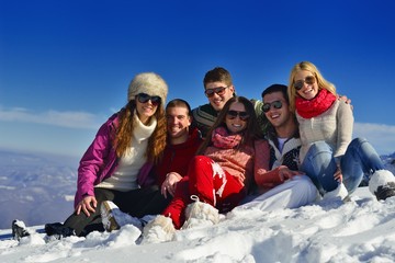 Fototapeta na wymiar friends have fun at winter on fresh snow