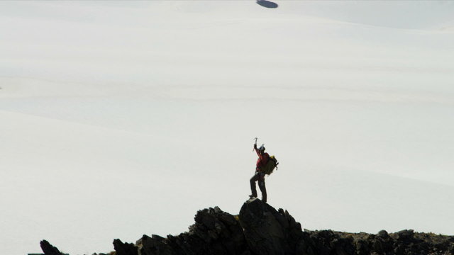 Aerial view of triumphant climber remote wilderness,  Alaska, USA