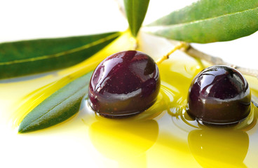 Black olives and olive oil closeup