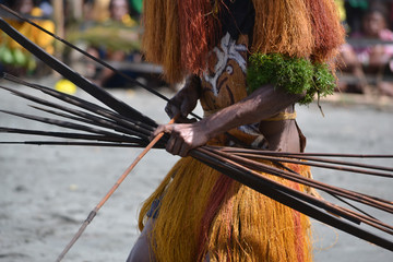 Man with bow and arrow traditional tribal weapon
