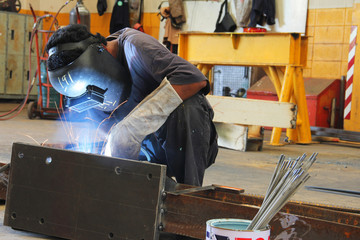 worker sitting welding
