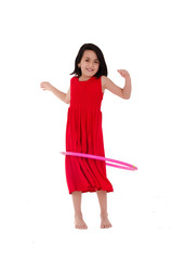 Young girl playing with hula hoop isolated over white background