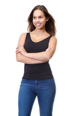 Obraz premium Happy young woman smiling with arms crossed