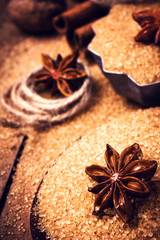 Cinnamon sticks and star anise on brown sugar