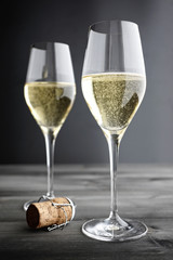 Two glasses of Champagne and Cork, selective focus