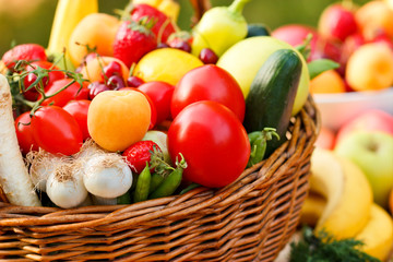 Fresh fruit and vegetables in a wicker basket