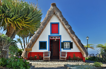 Front of a traditional cottage in Santana (Madeira, Portugal) - obrazy, fototapety, plakaty