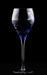 Wine glass with blue potion