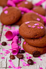 fresh chocolate cookies, coffee beans, pink ribbons and confetti