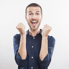 portrait of a winner young man on white background