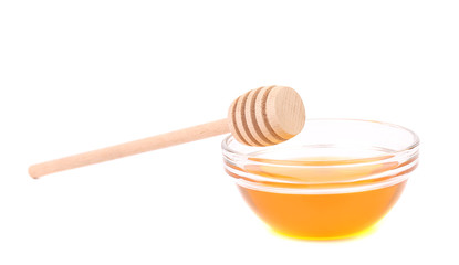 Bee honey with wooden dipper