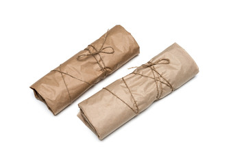 parcel package wrapped with brown kraft paper tied rope isolated