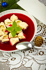 Traditional Christmas borscht with mushrooms filled in dumplings