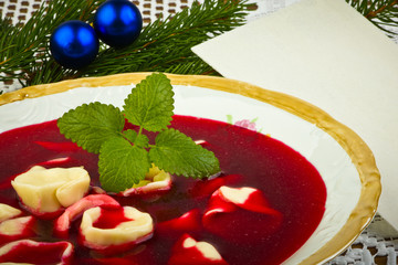 Traditional Christmas borscht with mushrooms filled in dumplings