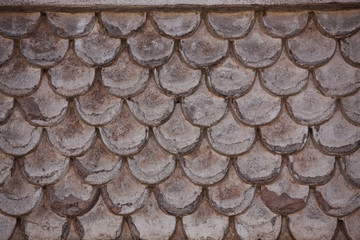 Fragment of the old wall, similar to shingles