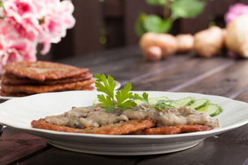 Potato pancakes with mushroom sauce