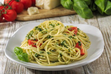 spaghetti with pesto and cherry tomatoes