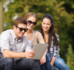 students or teenagers with laptop computers