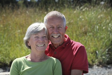 Happy old couple outside