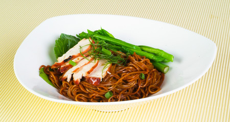 noodles and chicken on background