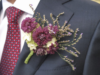 flower corsage on a man's suit - 58055783
