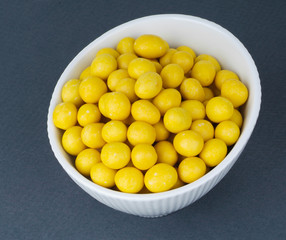 Covered Peanuts. sugar covered nuts on the background