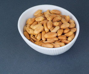 Salted, roasted, peanuts on the background