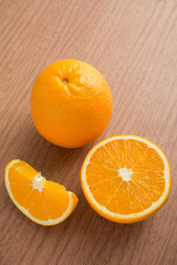 One orange and slices of orange