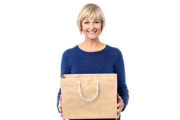 Pretty woman holding shopping bag