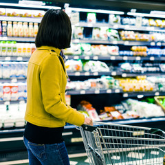 Young woman shopping in the supermarket