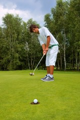 Golf, Golfer thrusting the ball into the hole