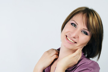 Fototapeta premium young emotional girl in a purple shirt with a short haircut