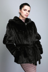 Naklejka premium A photo of sexual beautiful girl is in fur clothes