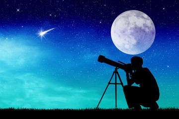 Man looks into the telescope - obrazy, fototapety, plakaty