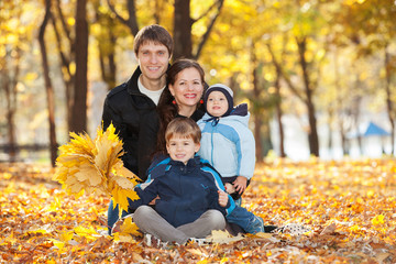 Happy family in the autumn park