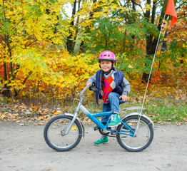 Fototapeta na wymiar Little boy on bicycle