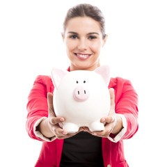 Business woman with a piggy bank