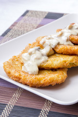 potato pancakes with mushroom sauce