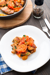 Fried pork with pan-roasted tomatoes