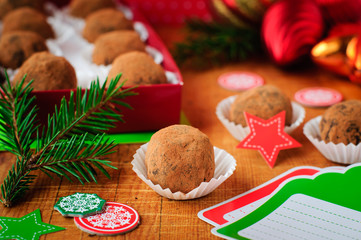 Obraz na płótnie Canvas Christmas Chocolate Truffles in a Gift Box, Christmas Decoration