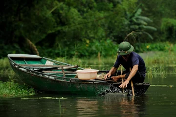 Foto op Canvas Vietnamese fisherman in tam coc © massimosp3