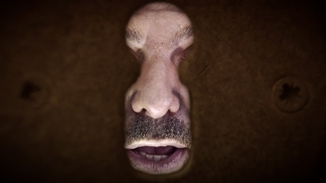 Old man angry comes really close keyhole