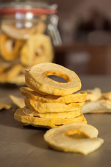 dried Apple Rings in a Jar on wooden Table