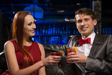 Young couple talking in a nightclub