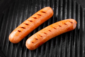Sausages on a grill