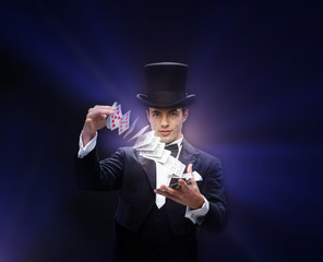 magician showing trick with playing cards