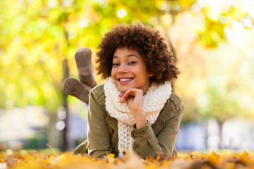 Autumn outdoor portrait of beautiful African American young woma